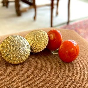 Two pair of vintage earrings. Croc print old gold tone clips. Amber swirl lucite